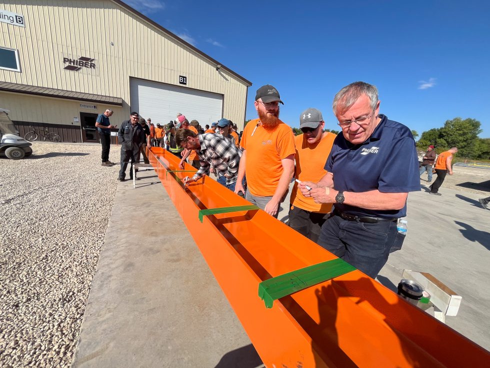 PhiBer Team Marks Milestone with Beam Signing Ceremony for New Facility Expansion
